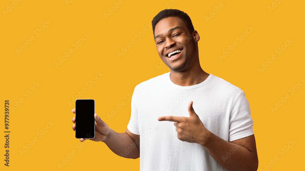 Poster Awesome Application Or Website. Black man showing blank cellphone screen for advertising text, empty space, mock up