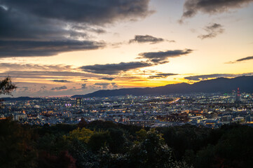 Aerial cityscape of Kyoto view at sunset with glowing city lights