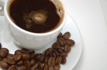 coffee, coffee beans, close-up on a white background, cup of coffee