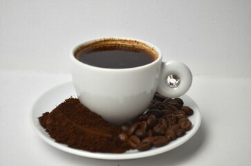 coffee, coffee beans, close-up on a white background, cup of coffee