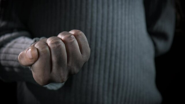 Dirty finger with indecent gesture. A view of female with dirty hands show the middle finger.