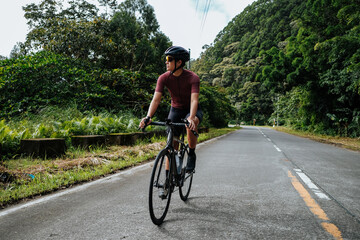 a young woman riding her gravel bike outdoors