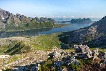 Obraz premium Rocky mountains with sea and lakes and rocks in front, Lofoten Norway