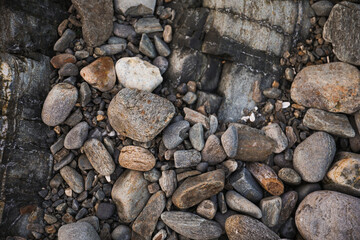serene beach scene with smooth rocks stacked in a balanced formation. The tranquil atmosphere evokes a sense of zen, harmony, and peace, symbolizing balance and mindfulness in nature