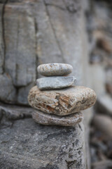 serene beach scene with smooth rocks stacked in a balanced formation. The tranquil atmosphere evokes a sense of zen, harmony, and peace, symbolizing balance and mindfulness in nature