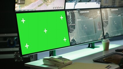 Soldier in military HQ base using green screen equipment to gather information on enemy troops....