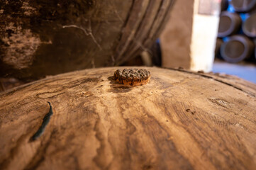 Solera system in old Andalusian wine cellar, process for aging sherry wine in barrels, fino, manzanilla, olorosso, amontillado jerez fortified wine, Sanlucar de Barrameda, Cadiz, Andalusia, Spain