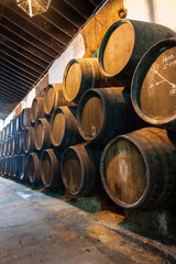 Solera system in old Andalusian wine cellar, process for aging sherry wine in barrels, fino, manzanilla, olorosso, amontillado jerez fortified wine, Sanlucar de Barrameda, Cadiz, Andalusia, Spain