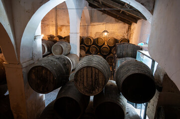 Solera system in old Andalusian wine cellar, process for aging sherry wine in barrels, fino, manzanilla, olorosso, amontillado jerez fortified wine, Sanlucar de Barrameda, Cadiz, Andalusia, Spain