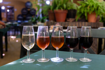 Flight of five sherry wine from barrels, fino, manzanilla, olorosso, amontillado, pedro ximenez jerez wines in old tavern, wine tasting, Sanlucar de Barrameda, Cadiz, Andalusia, Spain