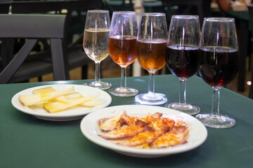 Tasting of sherry wines from barrels, fino, manzanilla, olorosso, amontillado jerez wines with traditional Andalusian tapas in old tavern, Sanlucar de Barrameda, Cadiz, Andalusia, Spain