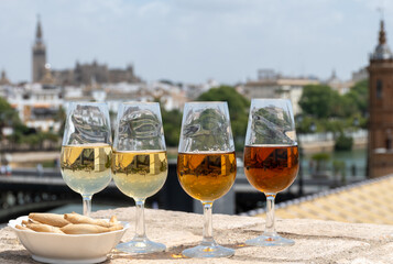 Sherry wine tasting on roof of old Triana district in Sevilla with view on Sevilla houses and...