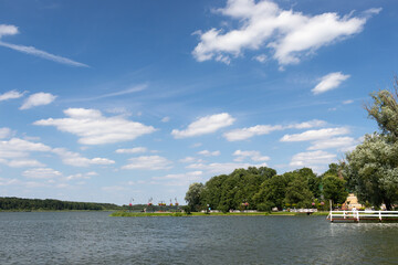 Summer landscape at Quay of Jezioro Berzyńskie lake in Wolsztyn, Greater Poland (Wielkopolska) covered in flowers.