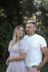 Happy couple at public park. Loving young couple having fun outdoors