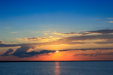 Summer Sunset on Lake Hefner in Oklahoma City, OK, USA, with a sailboat