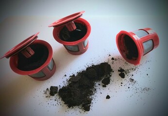 Coffee grounds scattered before composting from reusable beverage pods