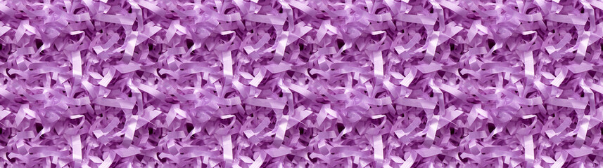 Fototapeta premium shredded paper filler in amethyst purple color with thindelicate strips, shredded paper filler texture background