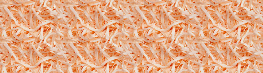 Fototapeta premium shredded paper filler in orange color with thin, delicate strips, shredded paper filler texture background