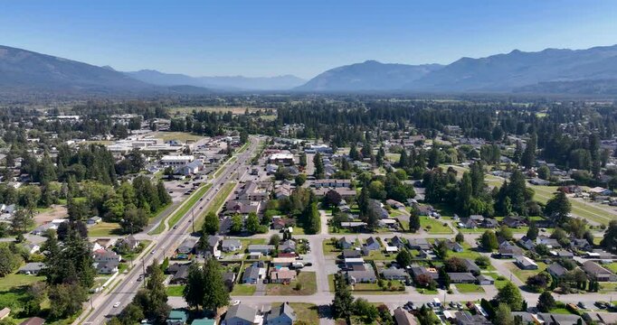 Overhead Landscape of Sedro-Woolley, Washington Homes, Highway 20, and Cascade Mountains During Summer