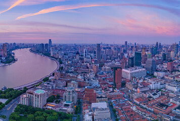 Aerial view of modern city skyline and buildings at sunrise in Shanghai