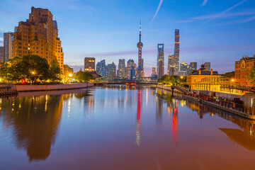 View of modern city skyline and buildings at sunrise in Shanghai