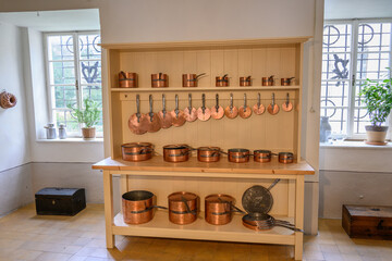 Set of copper dishes with lids.
