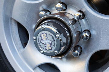 4x4 SUV truck front tire automatic hub locker close up high quality picture for download