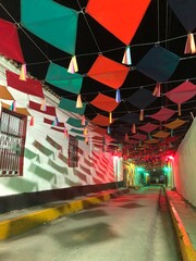 Colorful street decorated with paper kites near Carupano Ateneo, historic centre. Carúpano is considered the gateway to the Paria Peninsula and its main commercial and financial center.