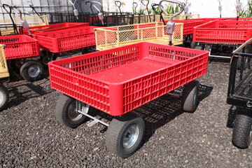 little red orange wagon for harvest in a upcik farm.  great harvesting farm transportation idea for all ages of visitors and toursts