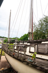 repair old wooden boat. Large ocean boat. Traditional wooden ships. ship repair workshop