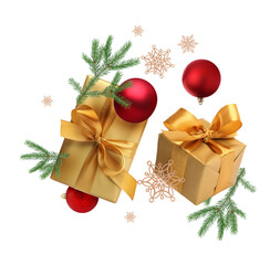 Gift boxes, Christmas balls, fir tree branches and decorative snowflakes in air on white background