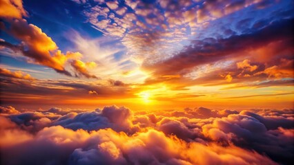 Obraz premium Vibrant sunset casting a warm glow over fluffy clouds in the sky, sunset, clouds, sky, colorful, vibrant, warm, glow, atmospheric