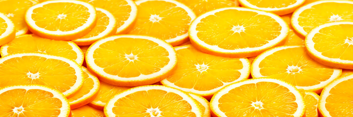 banner background with copy space juicy orange slices arranged in a delicious pattern.