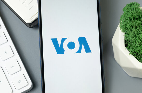 New York, USA - 30 August 2024: Voice of America VOA Logo on Phone Screen, Company Icon on Display
