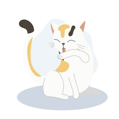 Cute kitten licking its arm for self-grooming,  cleanliness.  Adorable pet hygiene.