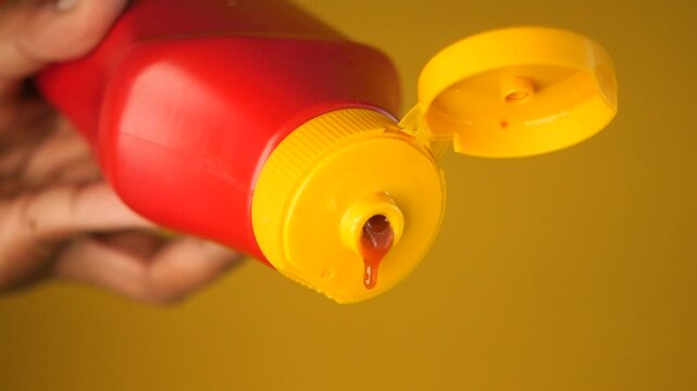 A CloseUp of a Ketchup Bottle that has an Open Lid Ready to Use for Dipping and Adding Flavor