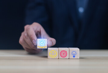 Businessman holding wooden cube quality certification icon with check mark
