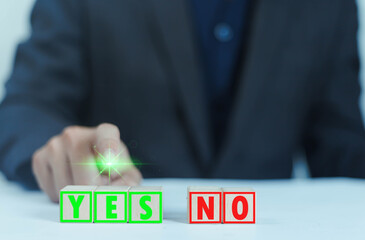 Wooden blocks showing right and wrong signs, decisions, votes and yes or no. Business options for...