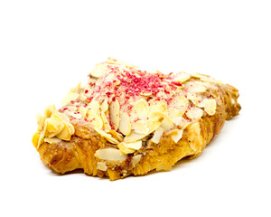 Almond croissants with sliced ​​almonds and dried raspberries sprinkled on top on an isolated white background