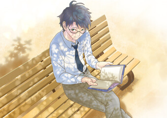 木漏れ日の下でベンチに座って読書をする男子学生