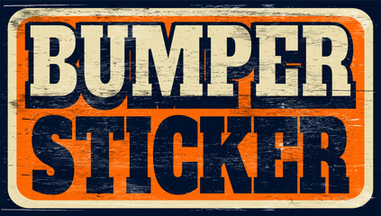 Aged and worn bumper sticker sign on wood