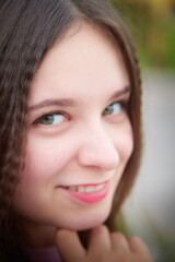 Fototapeta premium Portrait of young pretty woman with long brown hair
