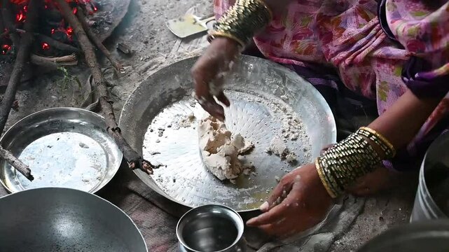 poor woman in village cooking food. Indian village women pilgrims cooking food traditional