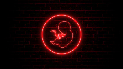 Neon, glowing human embryo. Human Cloning. Human fetus baby concept on brick wall.