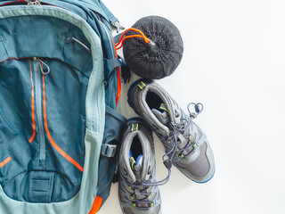 Hiking gear and camping equipment for travel on white background.