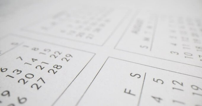 Closeup of calendar with the months of April and August