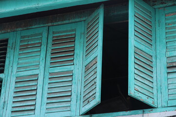 blue window with shutters