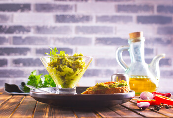 Traditional latinamerican mexican sauce guacamole in bowl