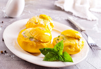 Veggie stuffed round cougretes on white plate