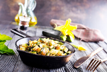 Frying pan with fried seasonal vegetables, spring food